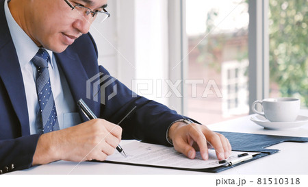Asian business man using pen signing on new contract to starting projects. working business man work outdoor. business concepts. 81510318