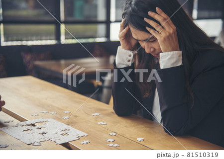 Asian businesswoman overworked at office stressful anxiety with serious problems. Woman exhaustion depress and mental burnout feeling tired frustrate at company office. Stress sadness contemplation 81510319