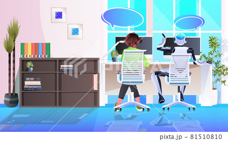 businesswoman and robot sitting at workplace artificial intelligence teamwork chat bubble communication concept 81510810