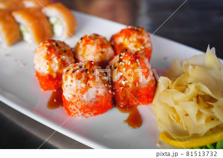 Japanese traditional baked roll with fish and sauce. sushi rolls California  81513732
