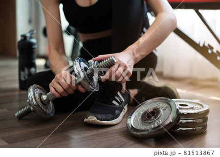 Woman exercise workout at home training sport with dumbbell and protein shake bottle healthy lifestyle bodybuilding, Athlete builder muscles lifestyle. 81513867