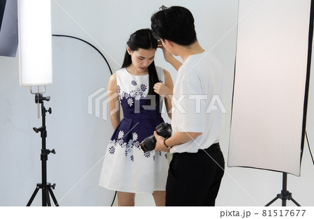 Asian man photographer and model woman taking pictures With dslr camera.  led light proper of flash and accessories. Concept photography take picture by camera. 81517677