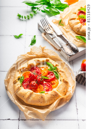 Fresh homemade galette with tomatoes, ricotta cheese and basil Fresh homemade galette with tomatoes, ricotta cheese and basil 81518429