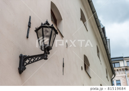 Vintage black gothic street wall lantern in old town of Riga Vecriga, Latvia 81519684
