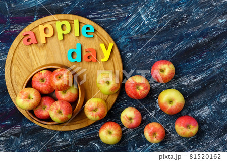 Apple is a national holiday on October 21. Red apples on a dark background. Top view 81520162