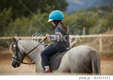 5-year-old girl riding a horse. infalltil sport concept 5-year-old girl riding a horse. infalltil sport concept 81523121