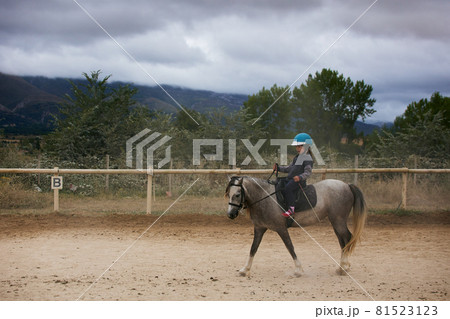 5-year-old girl riding a horse. infalltil sport concept 81523123