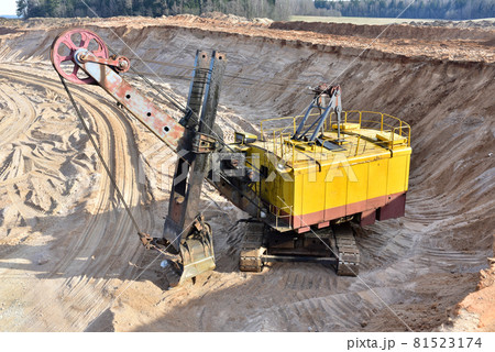 Huge mining excavator in the sand open-pit. Huge mining excavator in the sand open-pit. 81523174