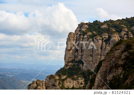 Montserrat is a mountain near Barcelona, in Catalonia. It is the site of a Benedictine abbey, Santa Maria de Montserrat, which hosts the Virgin of Montserrat sanctuary Montserrat is a mountain near Barcelona, in Catalonia. It is the site of a Benedictine abbey, Santa Maria de Montserrat, which hosts the Virgin of Montserrat sanctuary 81524321