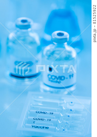 Bottle of COVOD-19 vaccine sample in a laboratory. Idea for researching and lab tests for coronavirus curing. Bottle of COVOD-19 vaccine sample in a laboratory. Idea for researching and lab tests for coronavirus curing. 81525922