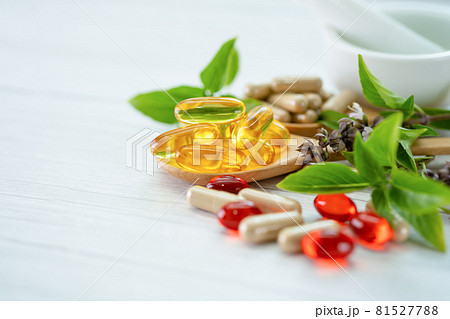 Alternative medicine herbal organic capsule with vitamin E omega 3 fish oil, mineral, drug with herbs leaf natural supplements for healthy good life. 81527788