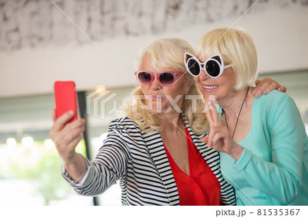 Two senior excited women making selfie and having fun 81535367