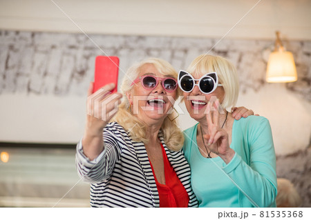 Two senior excited women making selfie and having fun 81535368