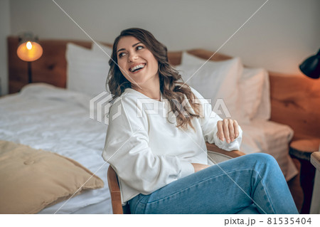 Pretty young long-haired woman in a white blouse 81535404