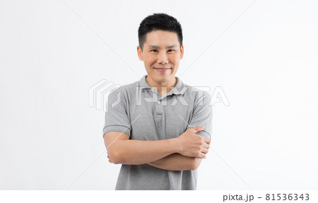 Portrait of Asian man with smile face poses with self-confidence folded arms looking to camera Portrait of Asian man with smile face poses with self-confidence folded arms looking to camera 81536343
