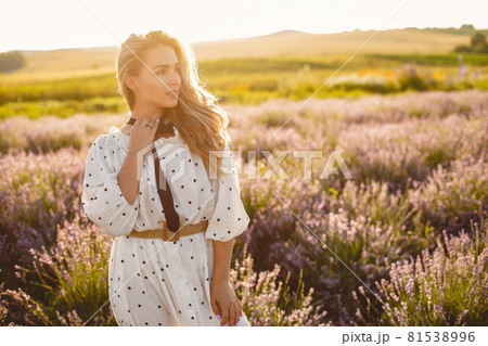 Woman in a white dress in a lavender field 81538996