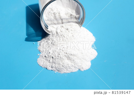 Baking soda on blue background. Baking soda on blue background. 81539147