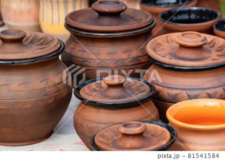 Set of handmade clay pots on the diy fair counter Set of handmade clay pots on the diy fair counter 81541584