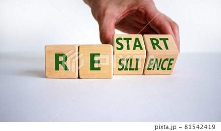 Restart and resilience symbol. Businessman turns cubes and changes the word 'restart' to 'resilience'. Beautiful white background. Business and restart - resilience concept. Copy space. Restart and resilience symbol. Businessman turns cubes and changes the word 'restart' to 'resilience'. Beautiful white background. Business and restart - resilience concept. Copy space. 81542419
