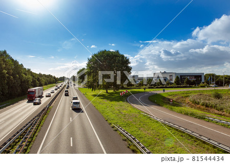 Cars and trucks driving on the A44 highway near Sassenheim Cars and trucks driving on the A44 highway near Sassenheim 81544434