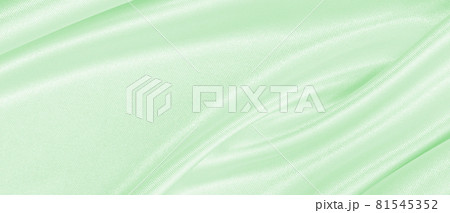 Smooth elegant green silk or satin luxury cloth texture as abstract background. Luxurious background design 81545352