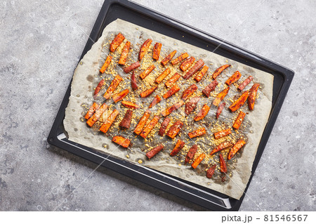 Sweet potato with cheese backed on baking sheet on grey background 81546567