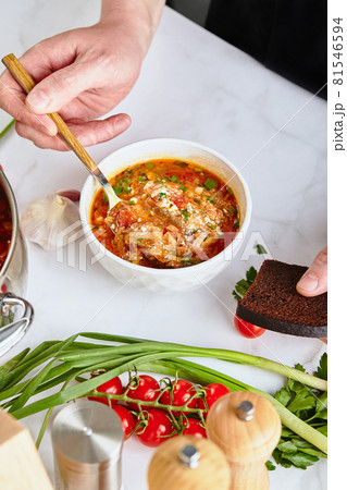 Ukrainian and Russian traditional red beet soup borsch, made from beets, cabbage, potatoes, beef and tomatoes 81546594