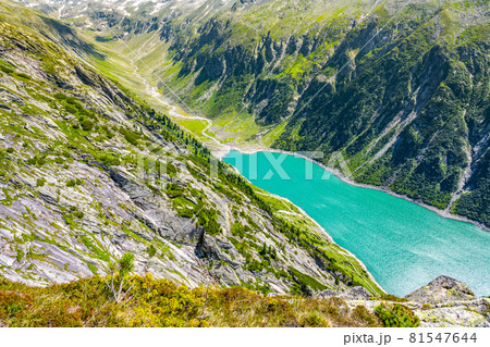 Beautiful alpine walley with azure blue water of Speicher Zillergrundl dam, Zillertal Alps, Austria Beautiful alpine walley with azure blue water of Speicher Zillergrundl dam, Zillertal Alps, Austria 81547644