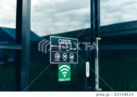 Text on cinematic black Open sign board on glass door in coffee shop. Text on cinematic black Open sign board on glass door in coffee shop. 81549614