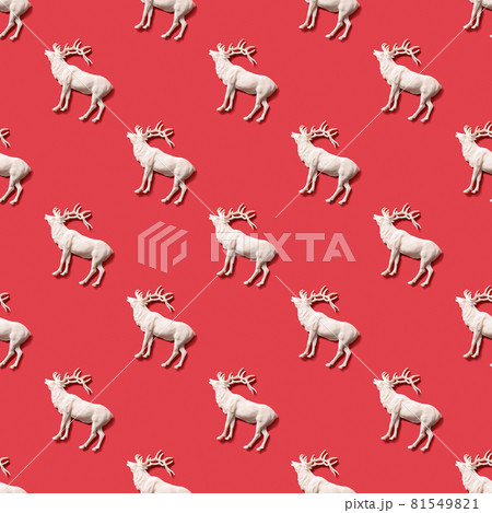 Seamless pattern with Christmas white deer on red. 81549821