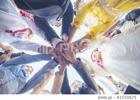 Diverse multiethnic Partners hands together teamwork group of multi racial people meeting join hands togetherness. Diversity people hands join empower partnership teams connection volunteer community 81550625