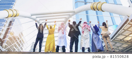 Banner Happy Diversity Teams multiethnic Partners standing with hands together in modern city. Panorama Teamwork group of multi racial confident happiness people joining trust teams partners outdoor Banner Happy Diversity Teams multiethnic Partners standing with hands together in modern city. Panorama Teamwork group of multi racial confident happiness people joining trust teams partners outdoor 81550628