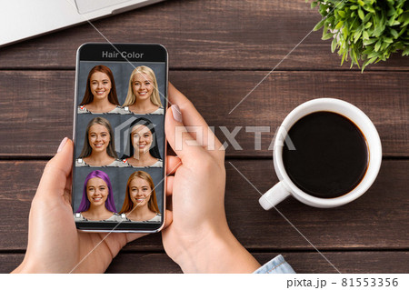Mobile software for hair creation. Woman using hair simulation app 81553356