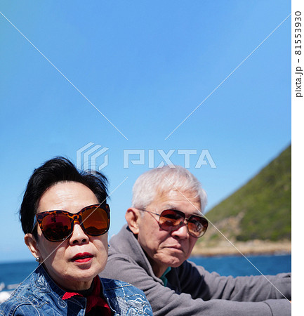 Asian senior elderly couple on tourist ferry boat to seals island trip attracion Fun wildlife watching aticity in South Africa trip 81553930