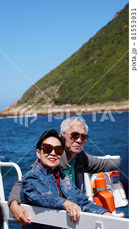 Asian senior elderly couple on tourist ferry boat to seals islan 81553931