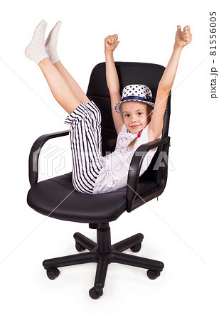 Office chair office chair office chair and little cheerful girl lifted her legs up isolated on white background. Modern adjustable chair from black leather. Office chair office chair office chair and little cheerful girl lifted her legs up isolated on white background. Modern adjustable chair from black leather. 81556005