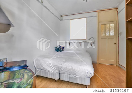 Interior of a cozy and bright bedroom with beautiful decoration 81556197