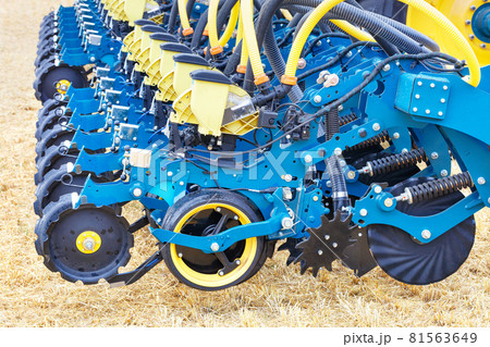 Modern blue multi-row seeder used in the agricultural sector. Modern blue multi-row seeder used in the agricultural sector. 81563649