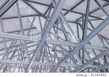 Metallic modern construction of roof overlap of the building closeup Metallic modern construction of roof overlap of the building closeup 81565892