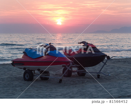 power boats (jet ski) on the beach at sunset power boats (jet ski) on the beach at sunset 81566452