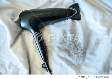 View of woman Hair fall/loss after using hair dryer. Hair loss maybe related from Family history (heredity) or Hormonal changes and medical conditions. View of woman Hair fall/loss after using hair dryer. Hair loss maybe related from Family history (heredity) or Hormonal changes and medical conditions. 81566500