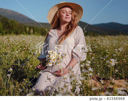 Beautiful pregnant woman relaxing outside in the park Beautiful pregnant woman relaxing outside in the park 81566968