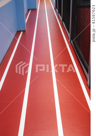 Red running track in children indoor activity park 81567623