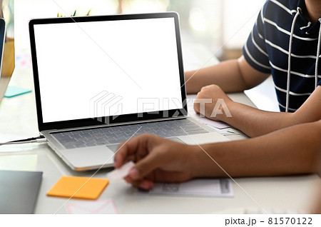Cropped shot of A group of designers working on a laptop. Cropped shot of A group of designers working on a laptop. 81570122