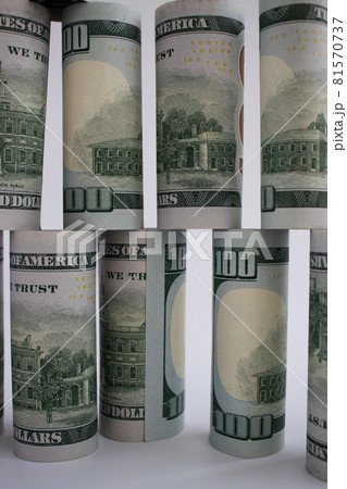The wall from 100 dollars banknotes. Money construction. 81570737