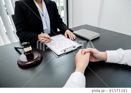 A woman lawyer or a judge counseling clients about judicial justice and prosecution with scales, judges gavel, legal documents legal services concept A woman lawyer or a judge counseling clients about judicial justice and prosecution with scales, judges gavel, legal documents legal services concept 81571161
