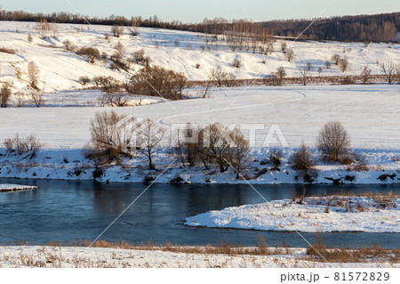 winter russian riverside wiew under direct evening sunlight winter russian riverside wiew under direct evening sunlight 81572829