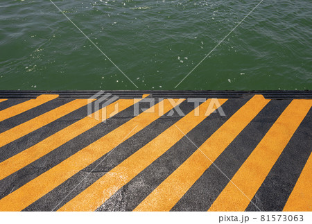 Orange and Black Quay of a Ferry Boat Station in Venice Lagoon Italy Orange and Black Quay of a Ferry Boat Station in Venice Lagoon Italy 81573063
