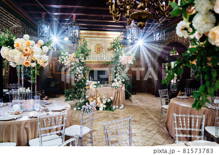 decor of fresh flowers in the restaurant for a wedding banquet. 81573783