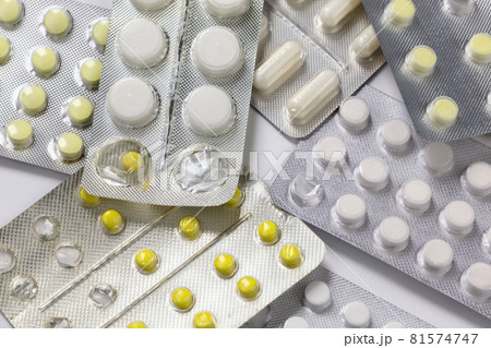 opened and partially used tablets blister background 81574747